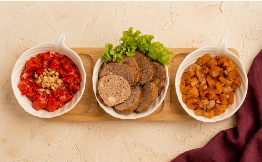 Derian mix at Derian, Yerevan — The three house dips together on a single board — the opening move when nobody can agree, with warm lavash alongside.